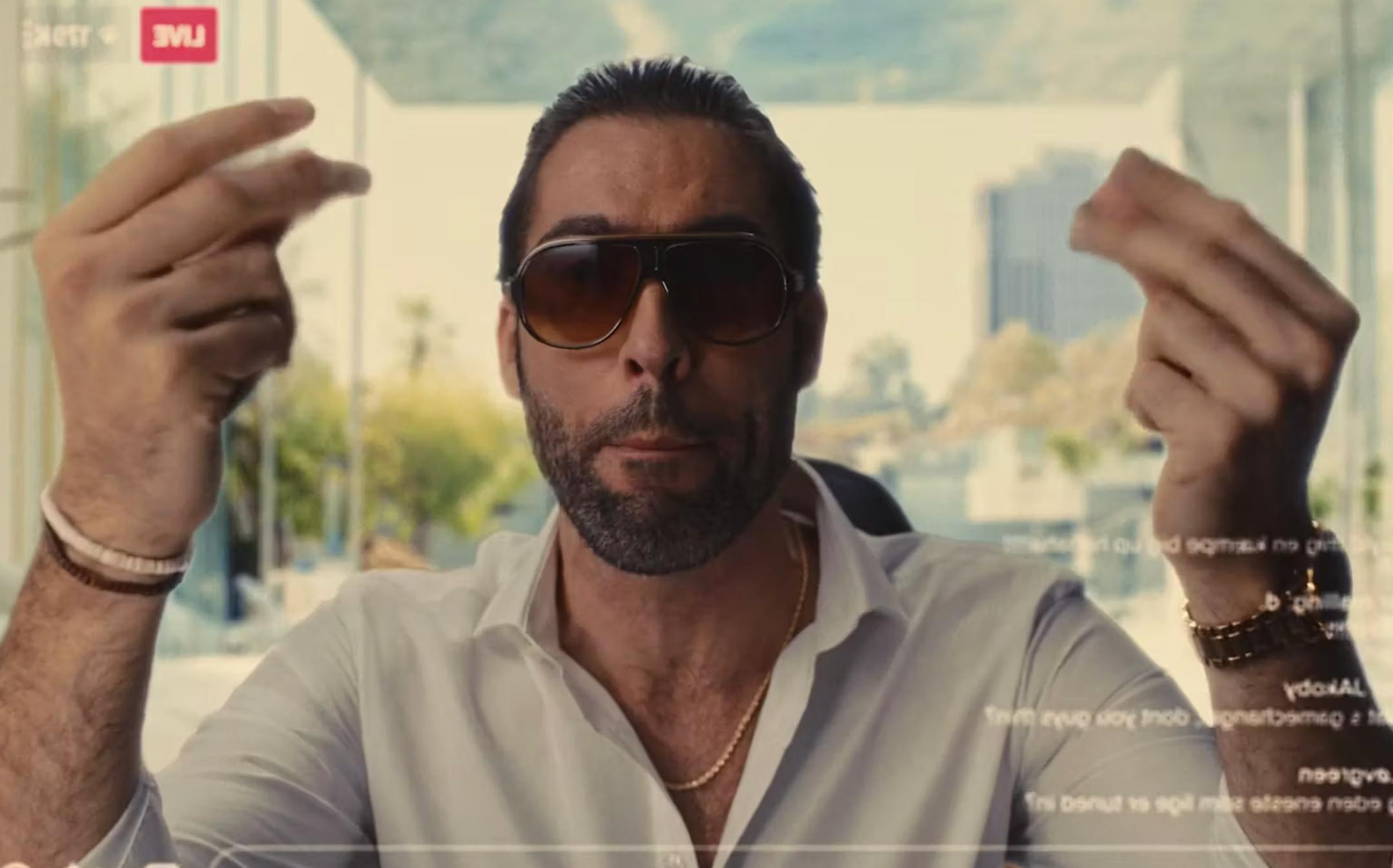 The thumbnail shows a man wearing sunglasses outdoors, captured in a bright, high-contrast lifestyle shot.