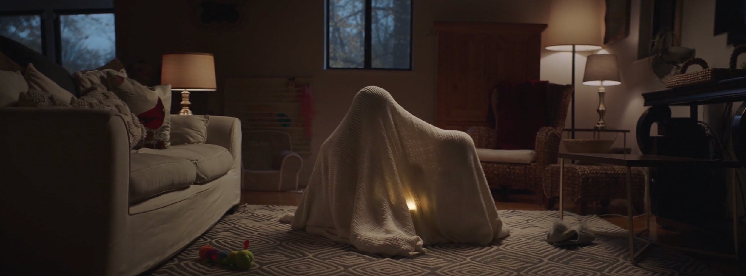 Low-light interior scene featuring creative lighting and set design.
