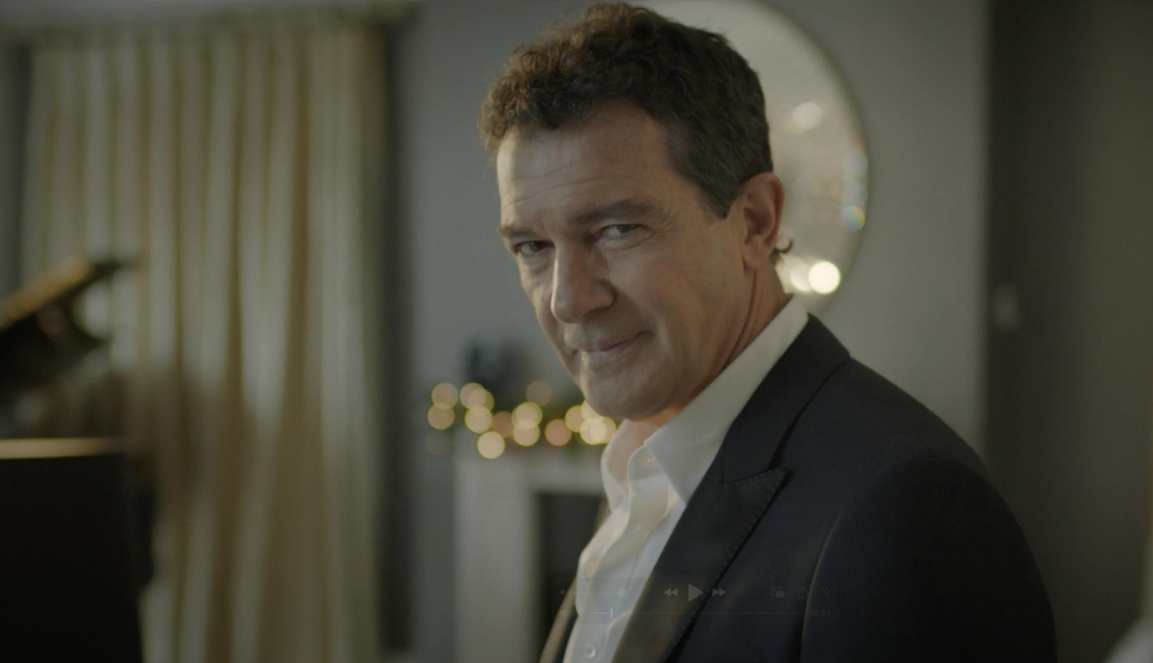 A man in a suit looking directly at the camera.