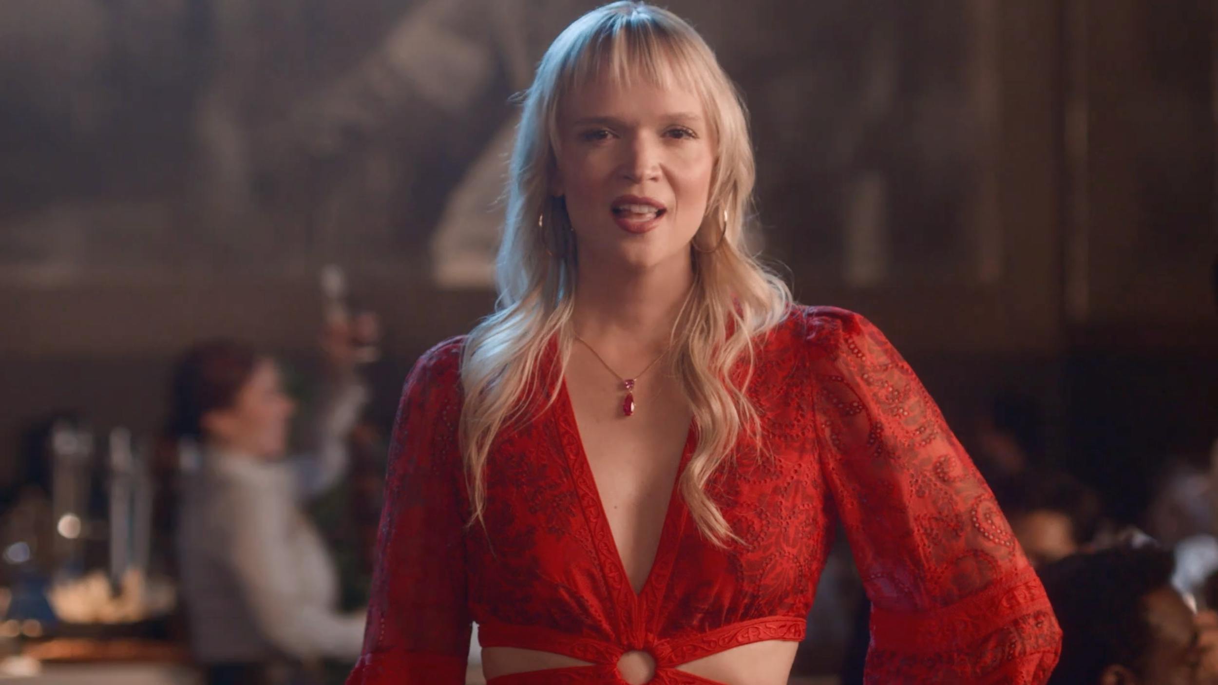 Cinematic medium shot of a female vocalist on a high-end film set.