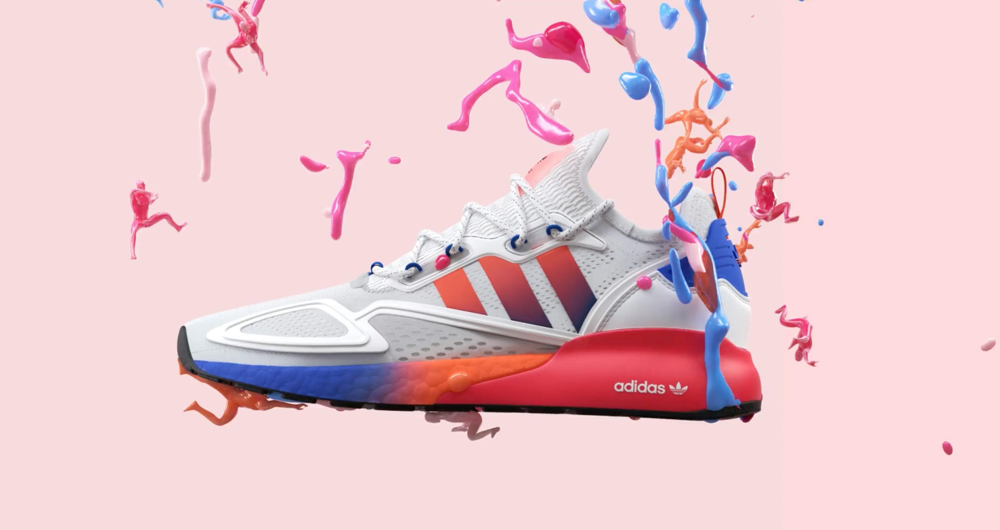 A stylized, high-contrast shot of a white athletic shoe against a pink and blue splashing background.