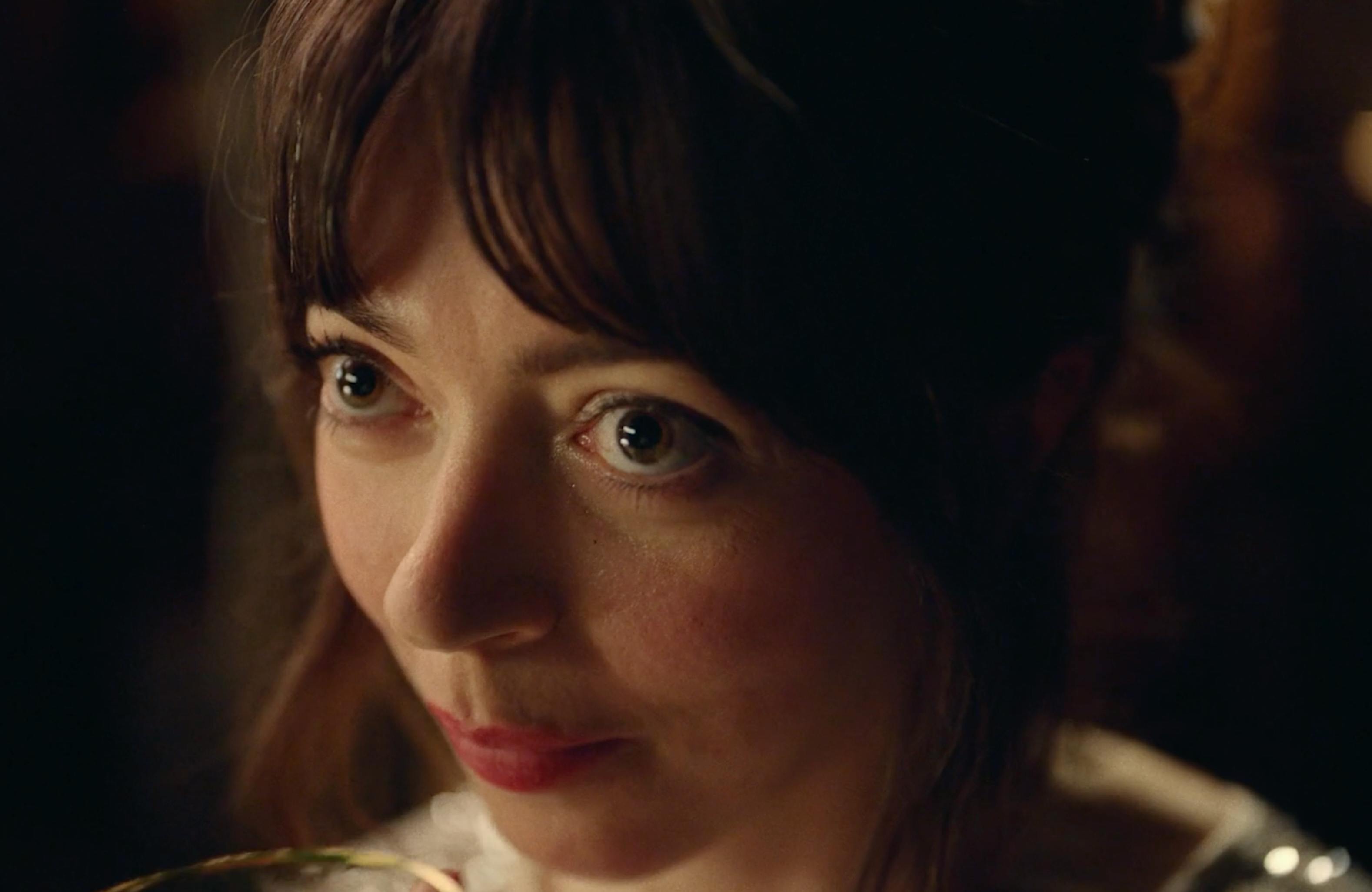 The Flirt: A close-up, dramatic shot of a woman’s face in profile, looking slightly downward with a serious expression.