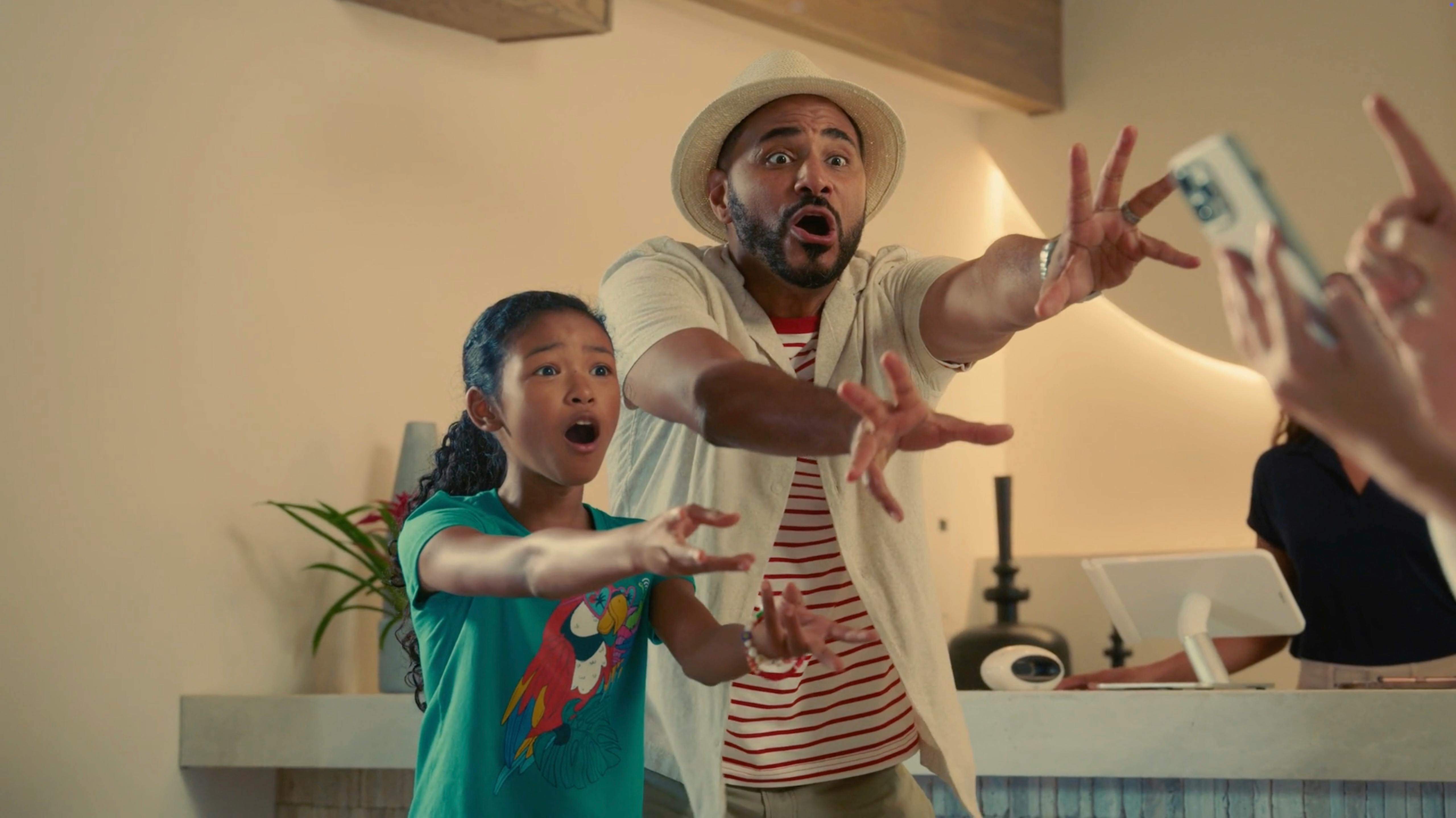 A man gesturing expressively in a bright kitchen, filmed by a full service video production company for commercial video production services