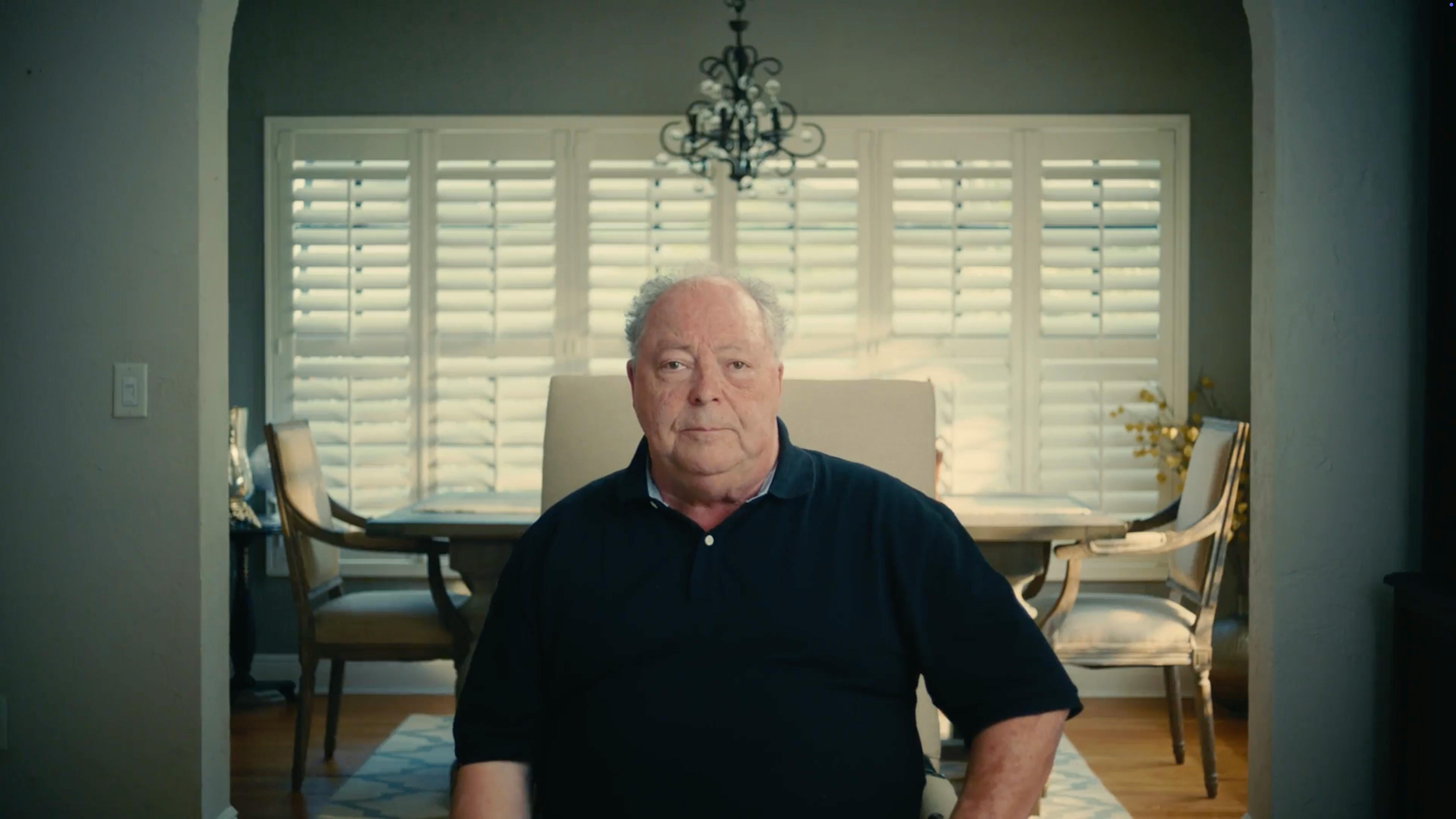 Older man in a classic armchair during a sit-down interview, filmed by a corporate video production NYC agency for branded content production