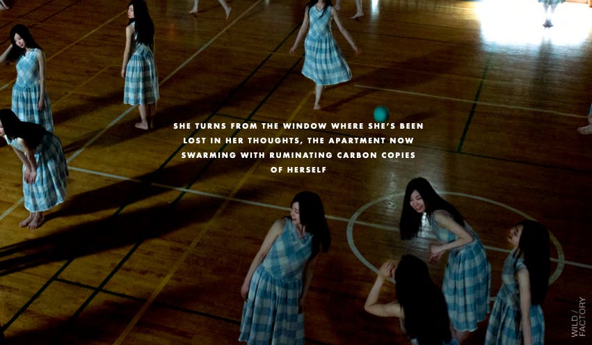 Women standing in a dimly lit hall during a cinematic campaign by a creative video agency for premium commercial advertising