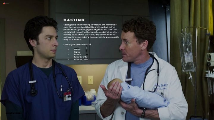 Two doctors holding a baby in a hospital scene created by local video production providers for a healthcare campaign