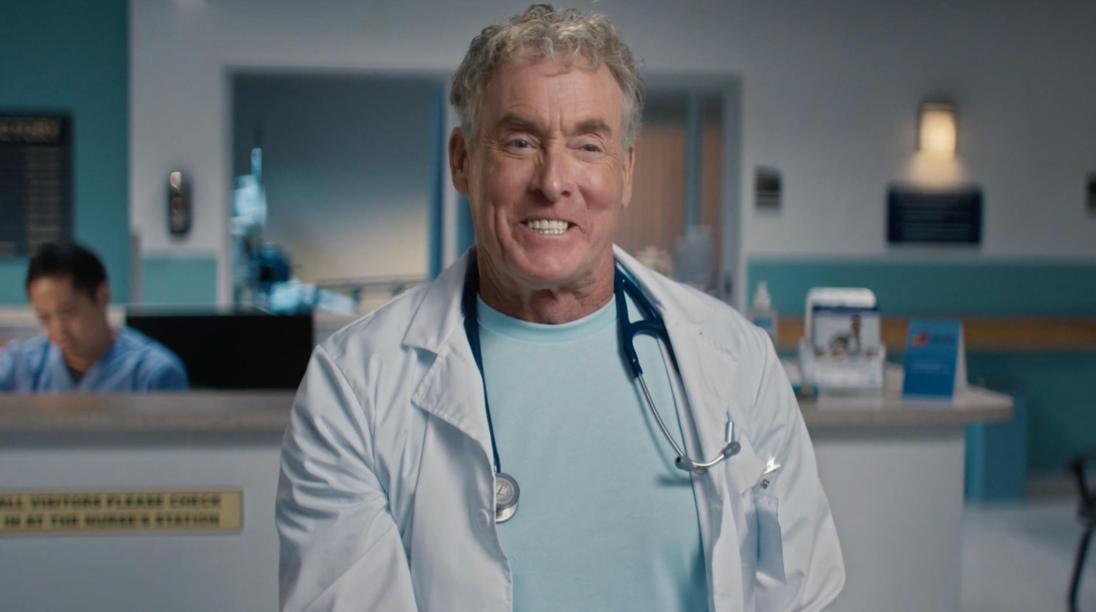 Doctor in scrubs on a telecom campaign set created by a full service video production company