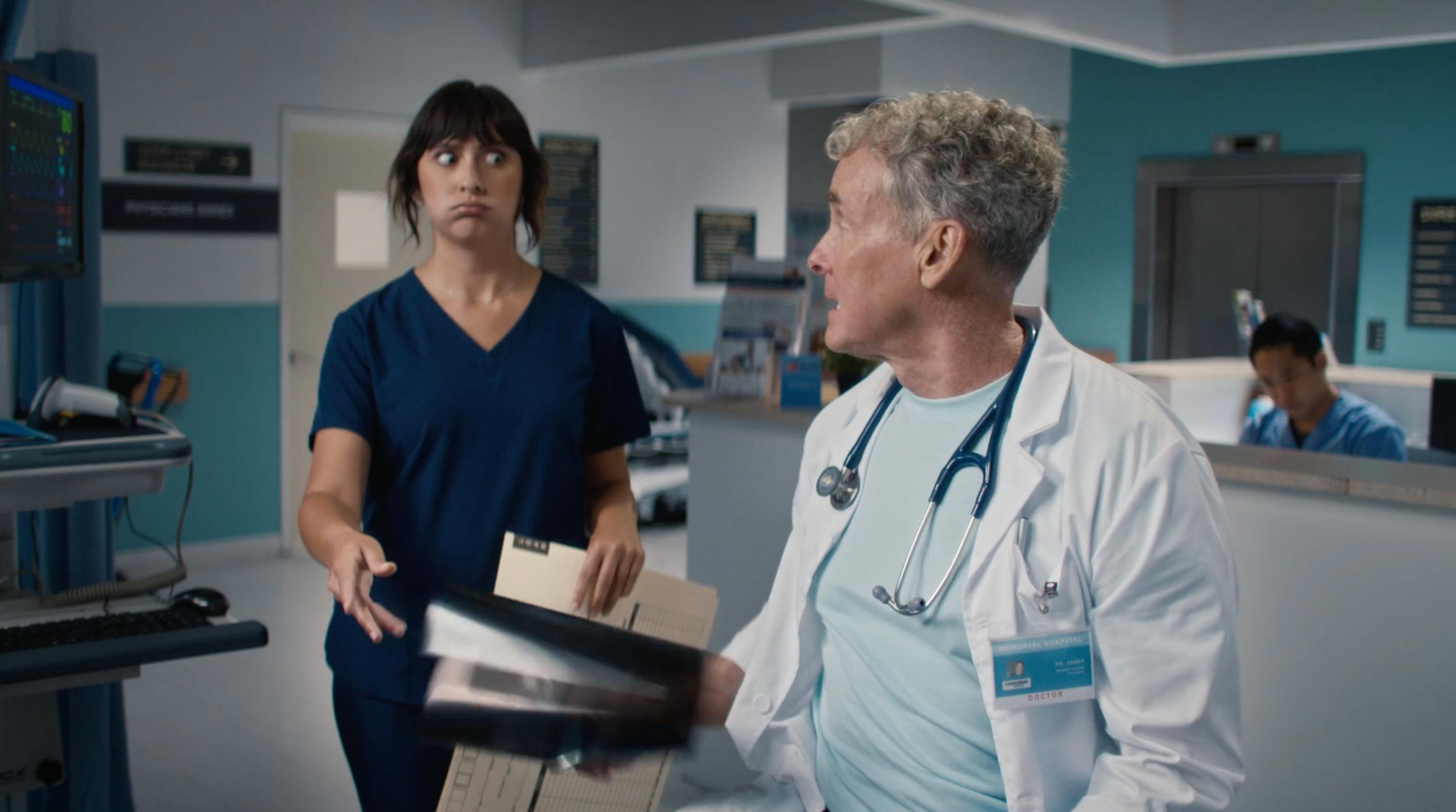 Nurse and doctor talking on a hospital set during visual asset productions for a telecom brand