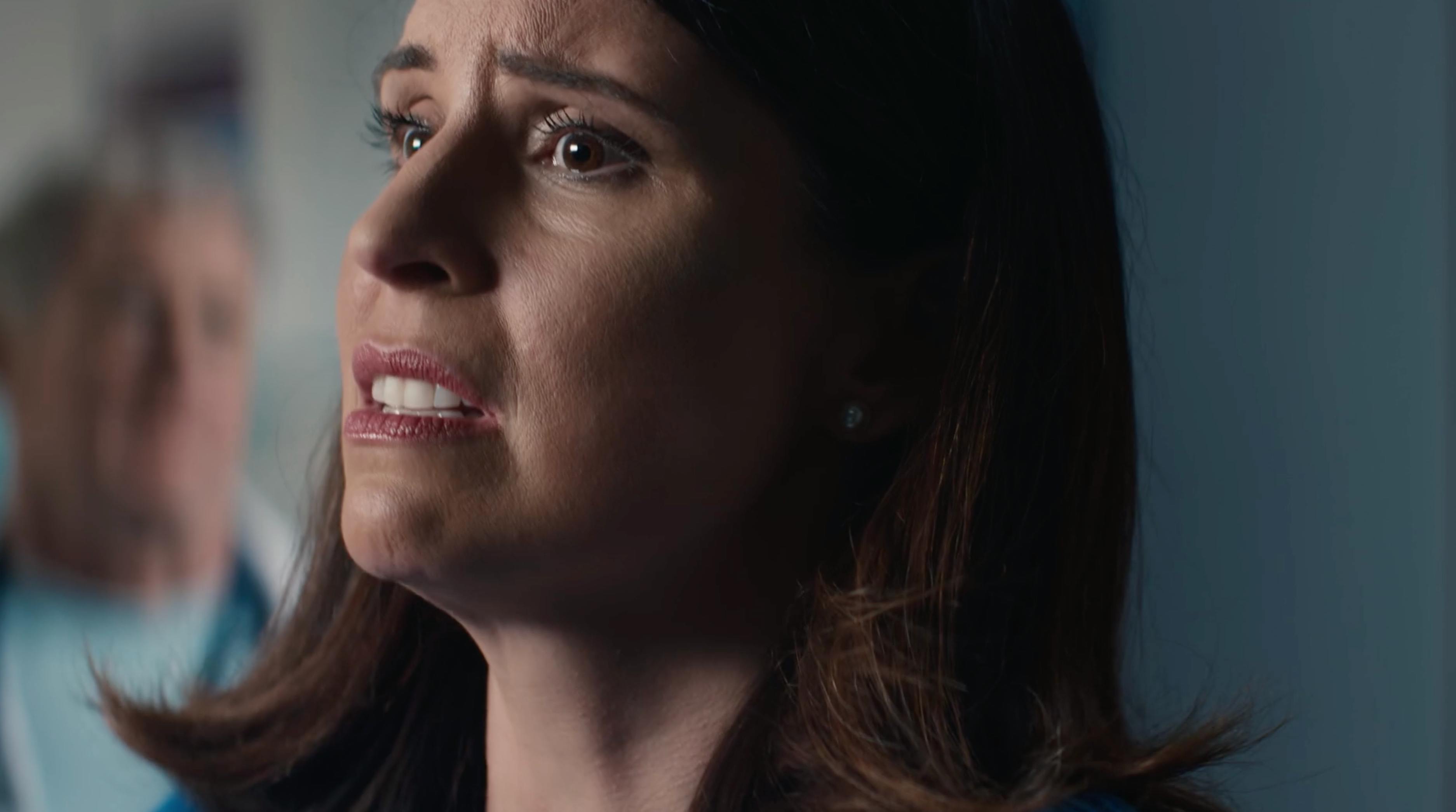Doctor speaking in a hospital set during a telecom ad produced by a commercial video production company