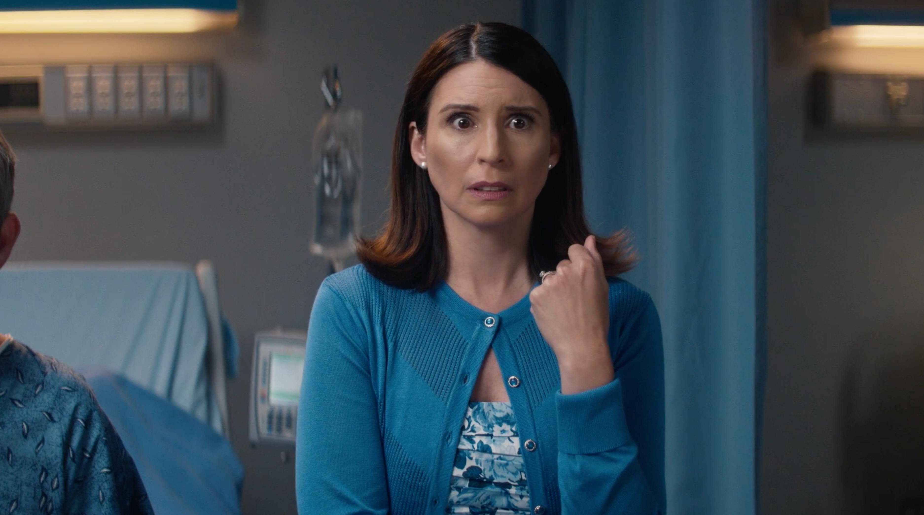 Woman standing beside a patient in a hospital room for social media video production company content