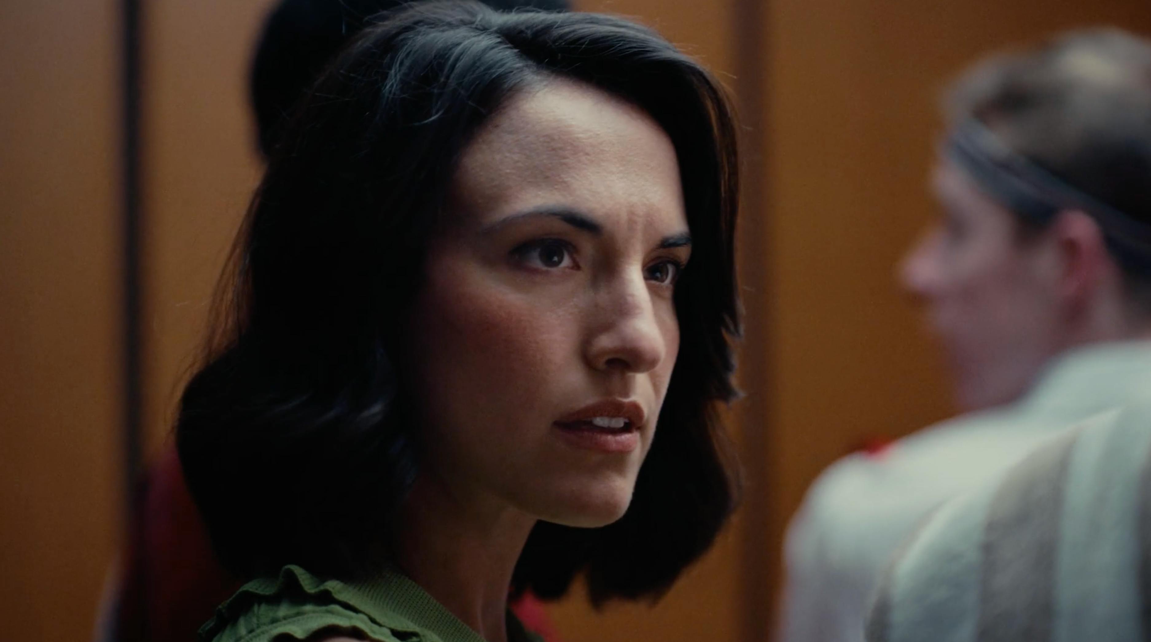 Close-up portrait of a woman in an elevator from a real estate executive video campaign