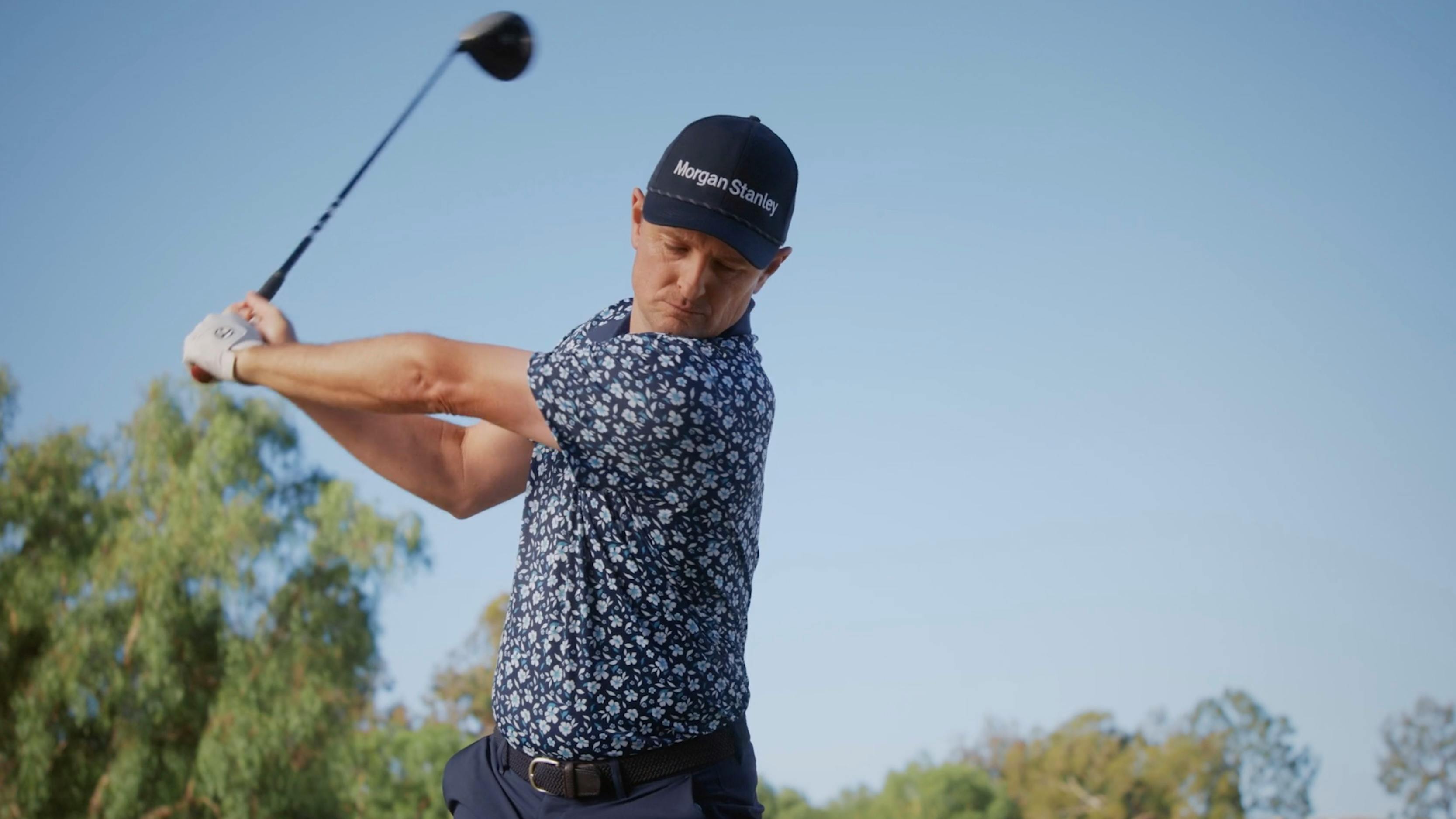 Golfer swinging a club on a California TV video film producers campaign shoot