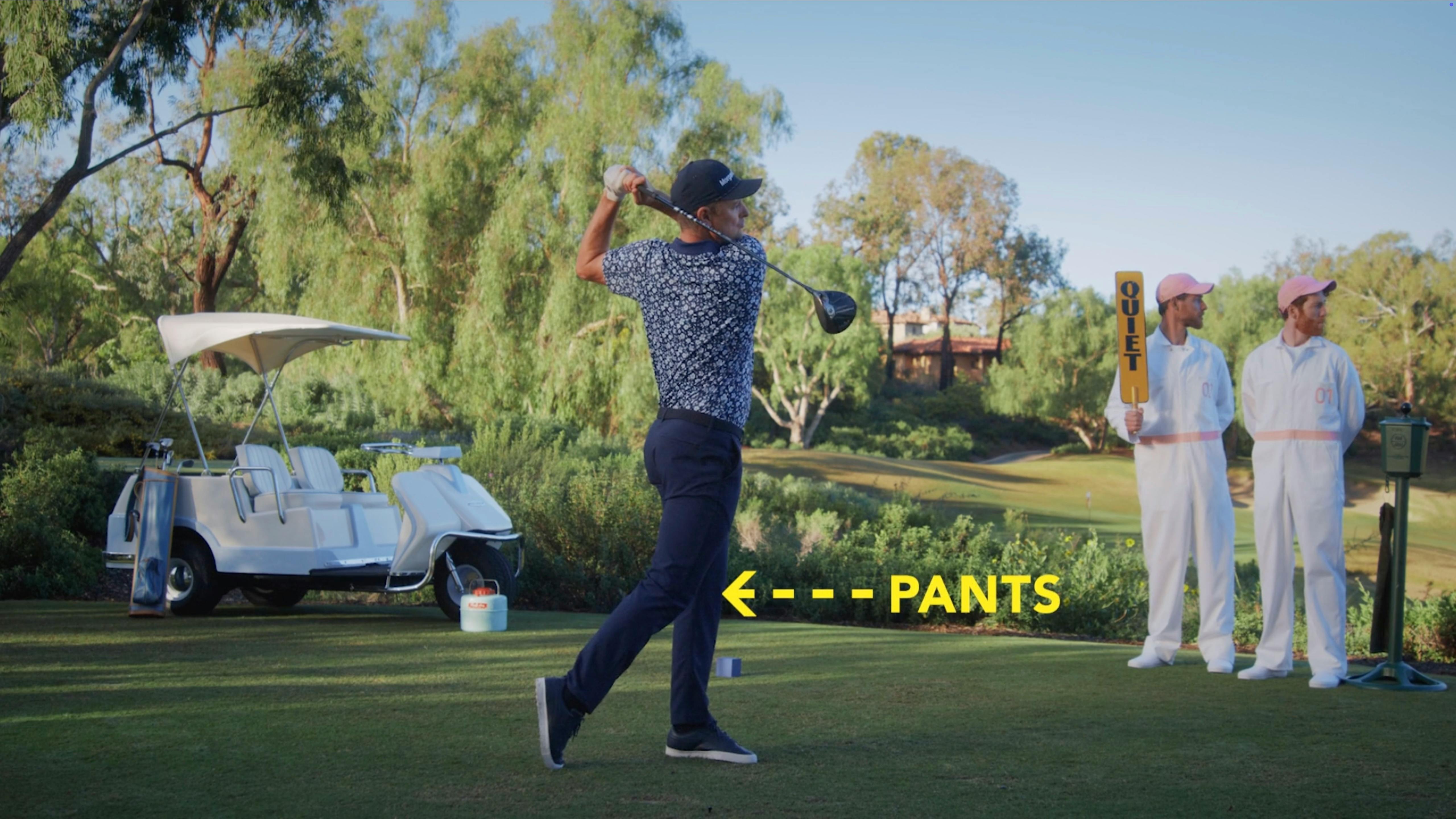 Golfer swinging on a course during an advertising photo production for a branded campaign